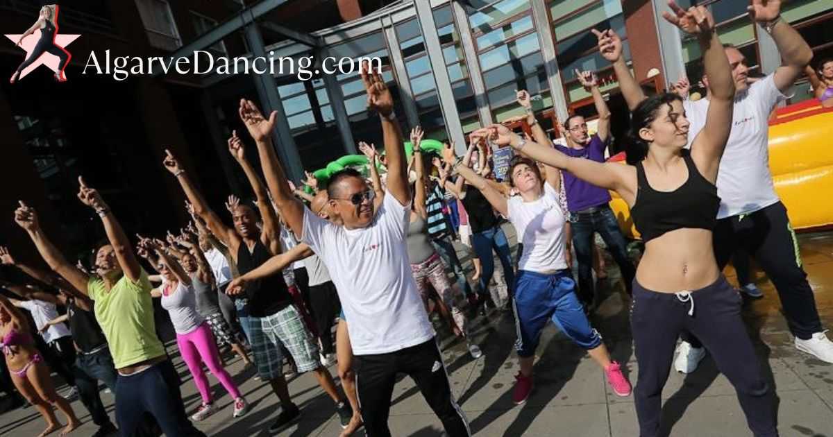 A diverse group of people joyfully dancing in unison, highlighting the universal appeal of dance.